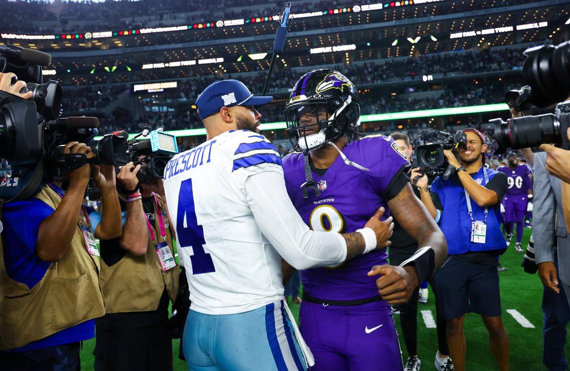  Sep 22, 2024; Arlington, Texas, USA; Dallas Cowboys quarterback Dak Prescott (4) hugs Baltimore Ravens quarterback Lamar Jackson (8) after the game at AT&T Stadium. Mandatory Credit: Kevin Jairaj-Imagn Images 