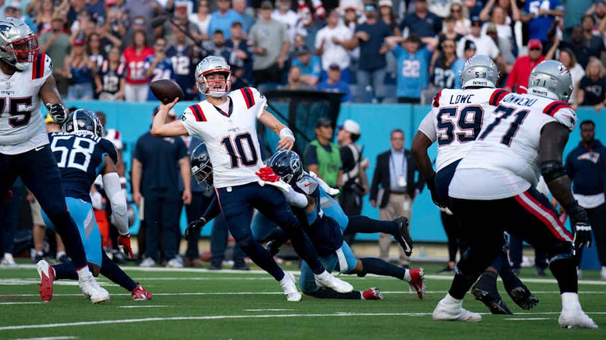  New England Patriots quarterback Drake Maye (10) throws while in the grasp of Tennessee Titans safety Mike Brown (44) during their game at Nissan Stadium in Nashville, Tenn., Sunday, Nov. 3, 2024. It was the last play of regulation and the New England Patriots running back Rhamondre Stevenson (38) came up with the reception in the end zone to force overtime. The play lasted more than 11 seconds as Mayes kept the play alive under constant pressure. | Denny Simmons / The Tennessean / USA TODAY NETWORK via Imagn Images 