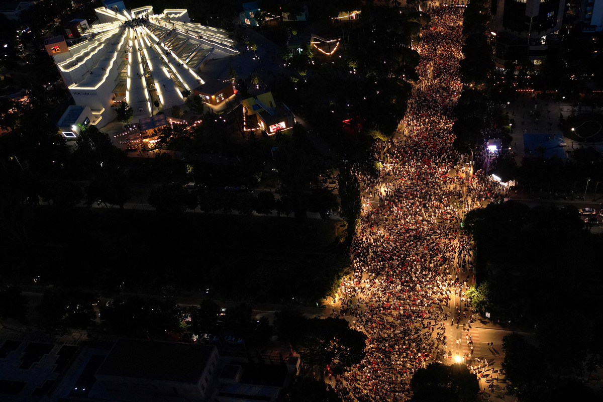 A drone view shows protesters taking part in a protest against a luxury resort, a plan by a company linked to U.S. President Donald Trump's son-in-law, Jared Kushner, on an environmentally sensitive part of the Adriatic coast, in Tirana, Albania, June 9, 2026. REUTERS/Florion Goga