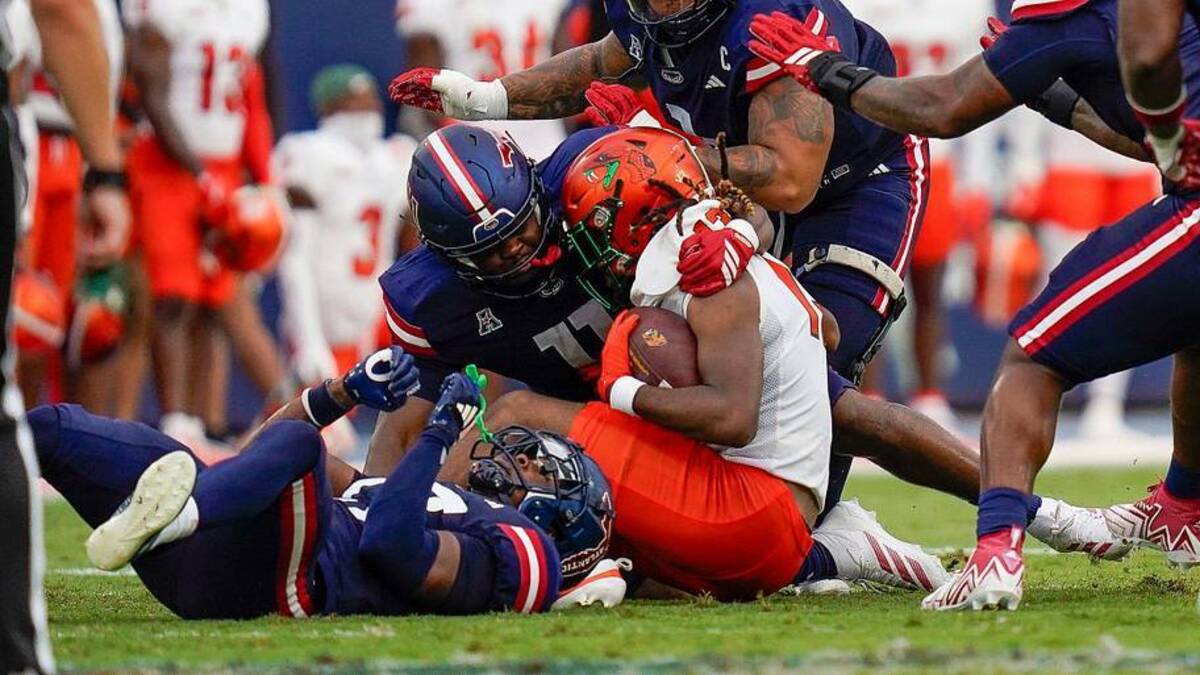  Florida A&M quarterback RJ Johnson (12) is sacked by Florida Atlantic defenders during first half action at FAU Stadium on Saturday, Sept. 6, 2025, in Boca Raton, FL. | Jeff Romance / USA TODAY NETWORK via Imagn Images 