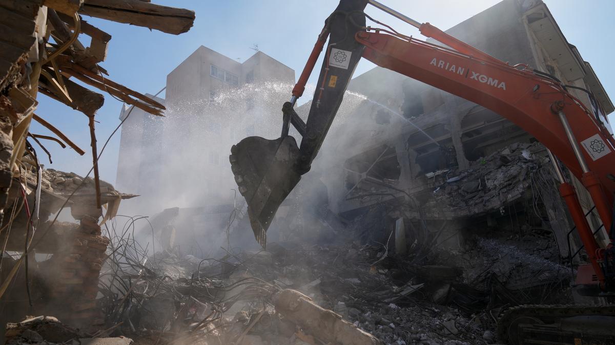 Iran Stress on Families. FILE - An excavator removes rubble at the site of a strike that, according to a security official at the scene, destroyed half of the Khorasaniha Synagogue and nearby residential buildings in Tehran, Iran, Tuesday, April 7, 2026. (AP Photo/Francisco Seco, File)