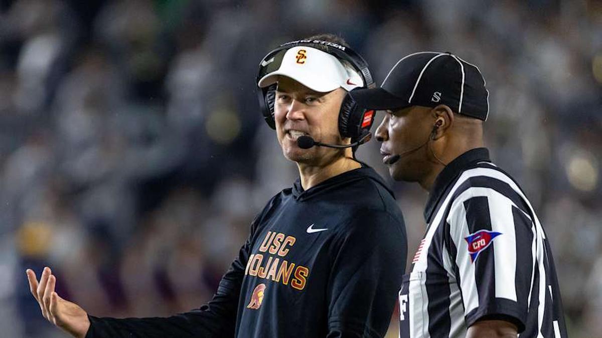  Oct 18, 2025; South Bend, Indiana, USA; Southern California Trojans head coach Lincoln Riley talks to an official during the first half against the Notre Dame Fighting Irish at Notre Dame Stadium. Mandatory Credit: Michael Caterina-Imagn Images | Michael Caterina-Imagn Images 