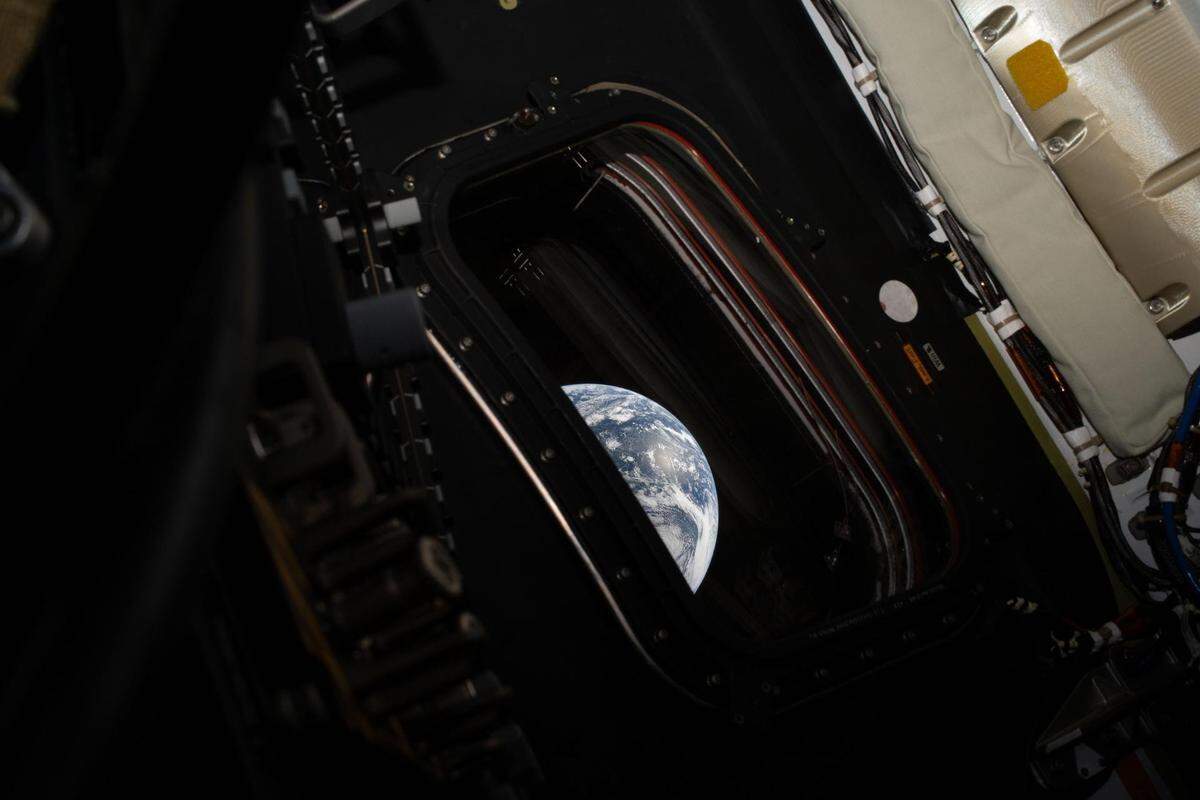 A view of Earth taken by NASA astronaut and Artemis II commander Reid Wiseman from the Orion spacecraft's window after completing the translunar injection burn on Thursday.