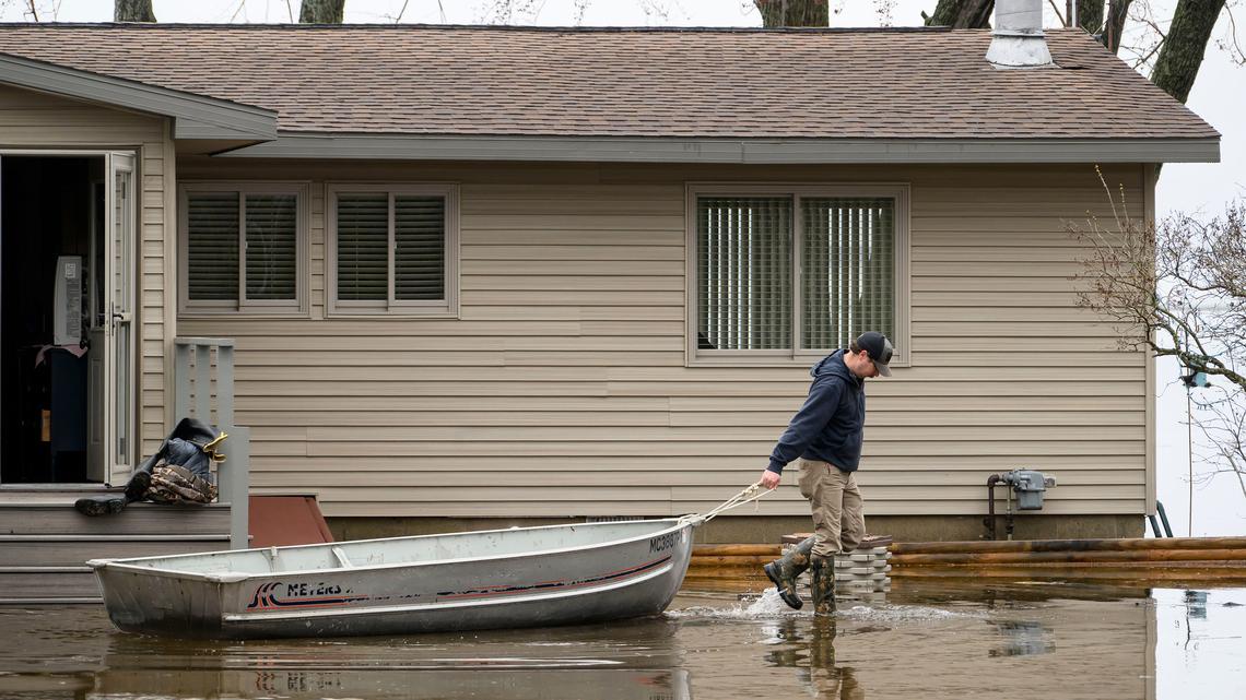 Northern Michigan lakeshore, homes surrounded by water after flooding 
