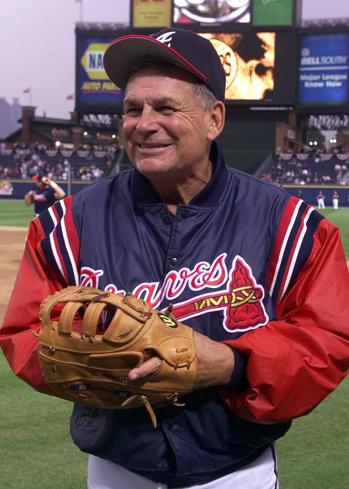 FILE-- The Atlanta Braves manager Bobby Cox watches a pre-game workout at Turner Field before Game 6 of the National League Championship Series against the New York Mets, in Atlanta, Oct. 19, 1999. Cox, a Hall of Famer who led the Atlanta Braves to five National League pennants and a World Series championship and ranks No. 4 for career victories as a manager, died in Marietta, Ga. on May 9, 2026. He was 84. (G. Paul Burnett/New York Times)
