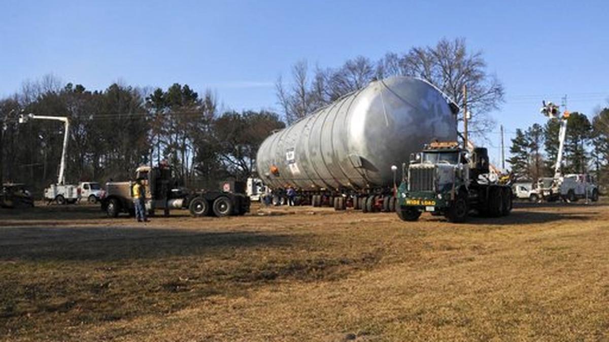 FILE - In this Feb. 11, 2016, file photo provided by the Louisiana National Guard, a controlled burn chamber arrives at Camp Minden in Minden, La. A federal judge has sentenced the former owner of a company involved in an explosion and cleanup in Louisiana to pay $34 million and spend 4 years and seven months in prison. KTBS-TV reports that former owner David Alan Smith, of Winchester, Kentucky, and four officials of his Explo Systems Inc. were sentenced Thursday, Nor. 29, 2018, in Shreveport.