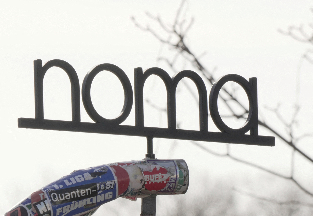 FILE PHOTO: A sign stands outside Noma restaurant, greenhouse, shop and cafe in Copenhagen, Denmark, March 12, 2026. REUTERS/Tom Little/File Photo