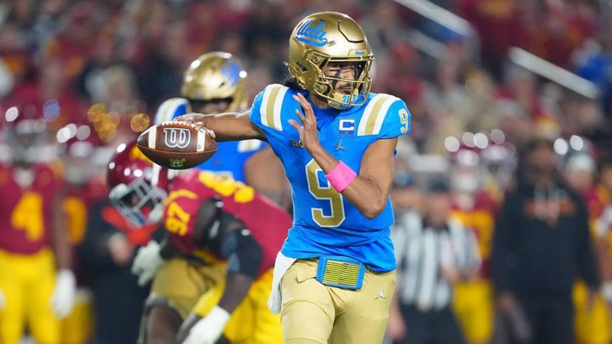  Nov 29, 2025; Los Angeles, California, USA; UCLA Bruins quarterback Nico Iamaleava (9) throws the ball against the Southern California Trojans in the first half at United Airlines Field at Los Angeles Memorial Coliseum. Mandatory Credit: Kirby Lee-Imagn Images | Kirby Lee-Imagn Images 