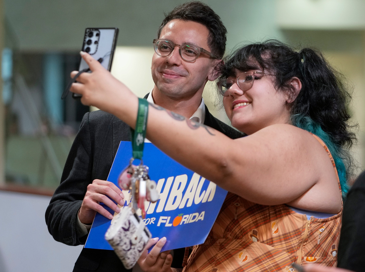 Florida Governor candidate James Fishback greets supporters following a campaign speech at the Marshall Student Center at the University of South Florida in Tampa.