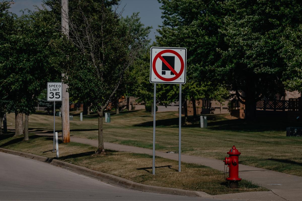 A no trucks sign by a community park in Elwood, Ill. on July 1, 2025. This year, a 1.1 million-square-foot logistics facility is expected to open beside the only school in Elwood. (Jamie Kelter Davis/The New York Times)....