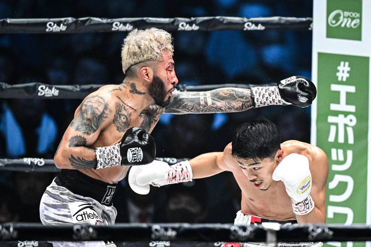  Alexandro Santiago (L) fights against Junto Nakatani (R) PHILIP FONG/AFP via Getty Images