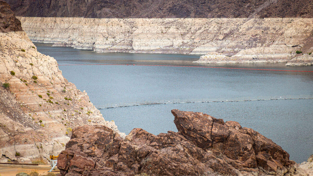 The greatly reduced Colorado River flows toward the Hoover Dam on April 26 outside of Las Vegas. The river basin is forecast to produce less than 30% of its average runoff and experienced its warmest March on record.