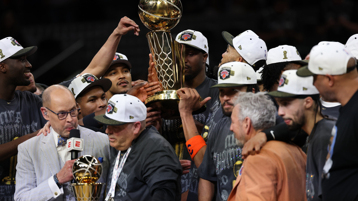 Knicks players celebrate with the Larry O'Brien championship trophy after beating the Spurs in five games to win the NBA title last week.