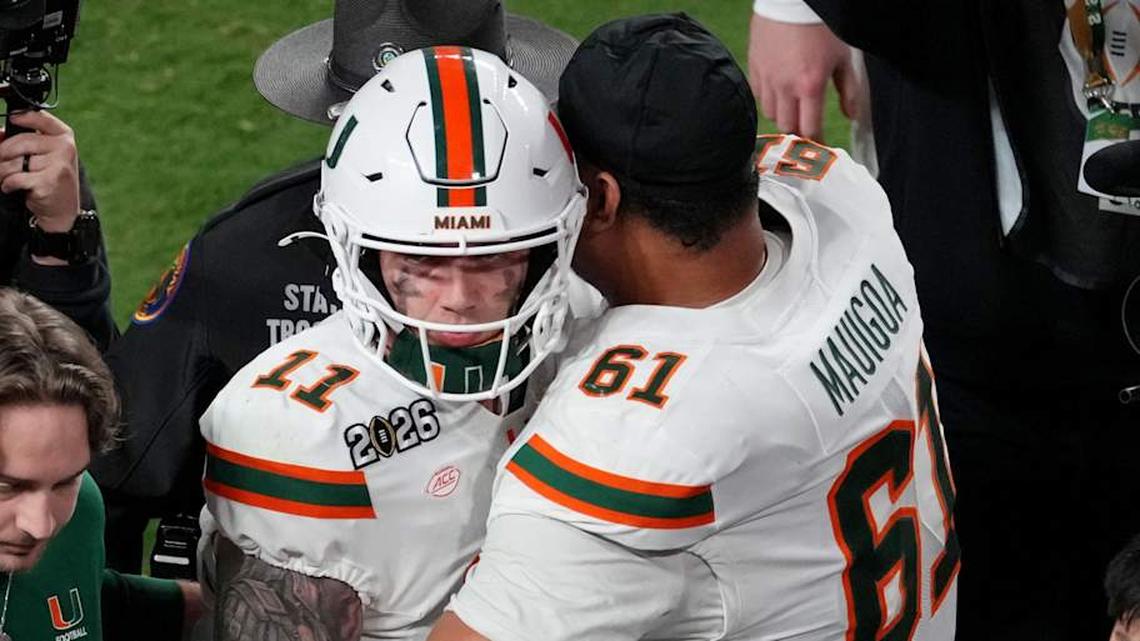  Jan 19, 2026; Miami Gardens, FL, USA; Miami Hurricanes offensive lineman Francis Mauigoa (61) hugs quarterback Carson Beck (11) after losing to Indiana Hoosiers inthe College Football Playoff National Championship game at Hard Rock Stadium. Mandatory Credit: James Lang-Imagn Images | James Lang-Imagn Images 