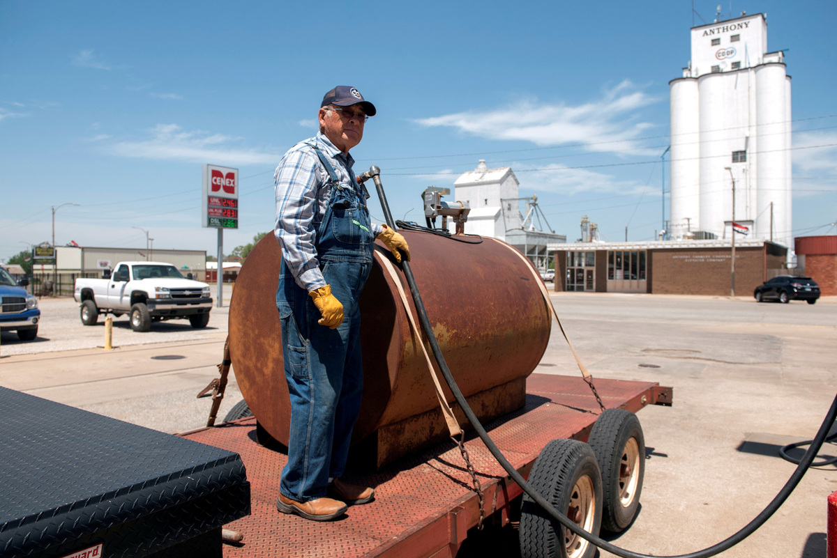 FILE PHOTO: Farmer Gerald Wolff pumps diesel fuel into a fuel tank to take it back to his farm in Harper, Kansas, U.S., May 11, 2018. Picture taken May 11, 2018. REUTERS/Nick Oxford/File Photo