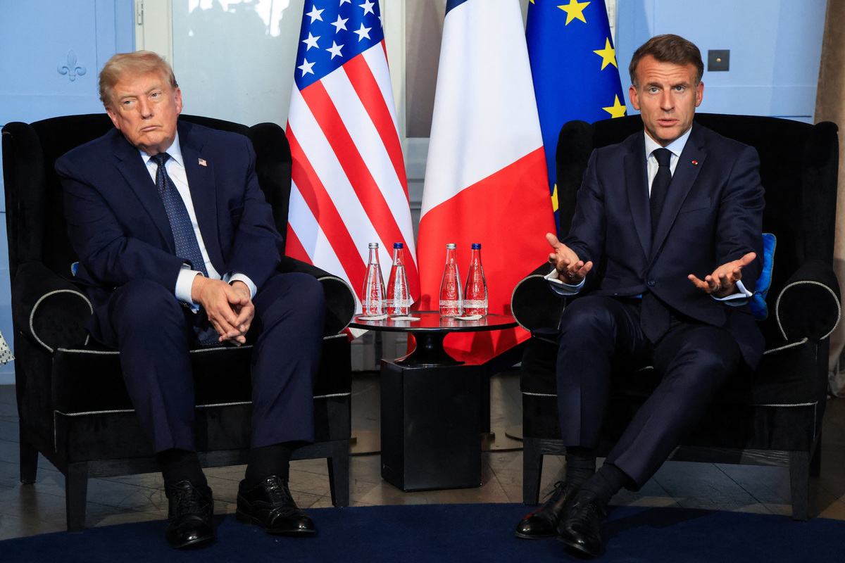 US President Donald Trump (L) attends a bilateral meeting with France's President Emmanuel Macron on the sidelines of the G7 summit, in Evian, France on June 15, 2026.  LUDOVIC MARIN/Pool via REUTERS