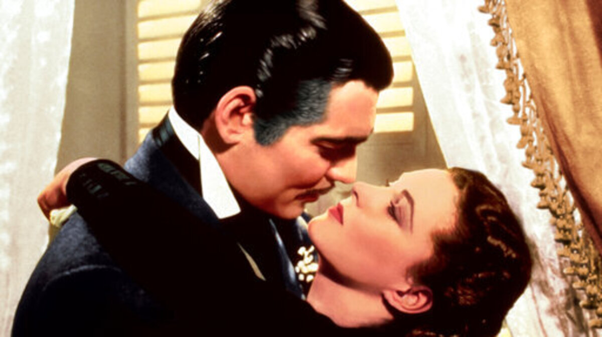 This image released by Turner Classic Movies shows Clark Gable, left, and Vivien Leigh in a scene from “Gone with the Wind.” On Thursday, the TCM Classic Film Festival will open its 10th annual edition in Los Angeles with “When Harry Met Sally...” To mark its anniversary, TCM will on Sunday again air “Gone With the Wind,” the film that it first transmitted on April 14, 1994. (Turner Classic Movies via AP)