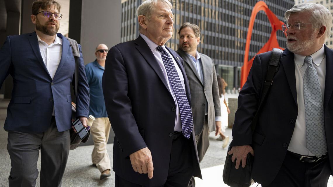 Michael McClain, middle, a lobbyist and longtime confidant of former House Speaker Michael Madigan, leaves the Dirksen U.S. Courthouse in Chicago after being sentenced, July 24, 2025, for his role in the "ComEd Four" trial. (Brian Cassella/Chicago Tribune)