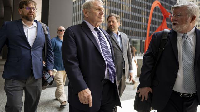 Michael McClain, middle, a lobbyist and longtime confidant of former House Speaker Michael Madigan, leaves the Dirksen U.S. Courthouse in Chicago after being sentenced, July 24, 2025, for his role in the "ComEd Four" trial. (Brian Cassella/Chicago Tribune)