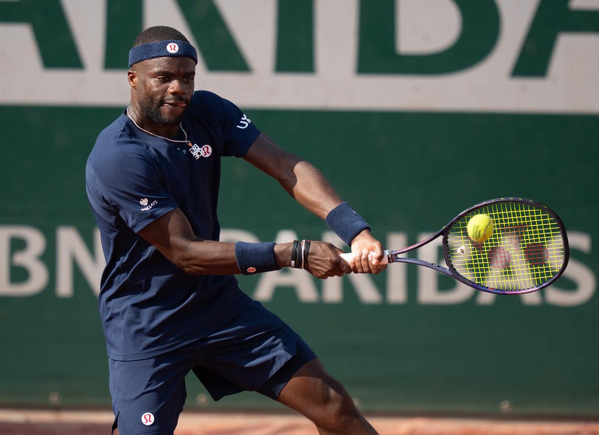 May 28, 2026; Paris, France; Frances Tiafoe of the United States returns a shot during his match against Hubert Hurkacz of Poland on day five at Stade Roland Garros. Mandatory Credit: Susan Mullane-Imagn Images