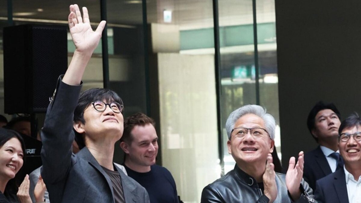 U.S. chip giant Nvidia Corp. CEO Jensen Huang (R), accompanied by Lee Hae-jin, founder and Chair of internet giant Naver Corp., acknowledge visitors during their meeting at the Naver headquarters in Seongnam, south of Seoul, South Korea, 08 June 2026. Photo by YONHAP / EPA