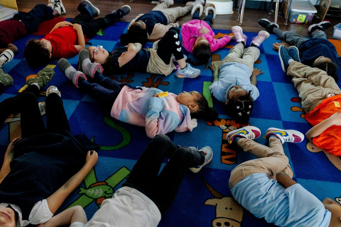  Kindergarten students practice a guided meditation visualization at McKinley STEAM Academy. Credit: Sylvia Jarrus for The Hechinger Report