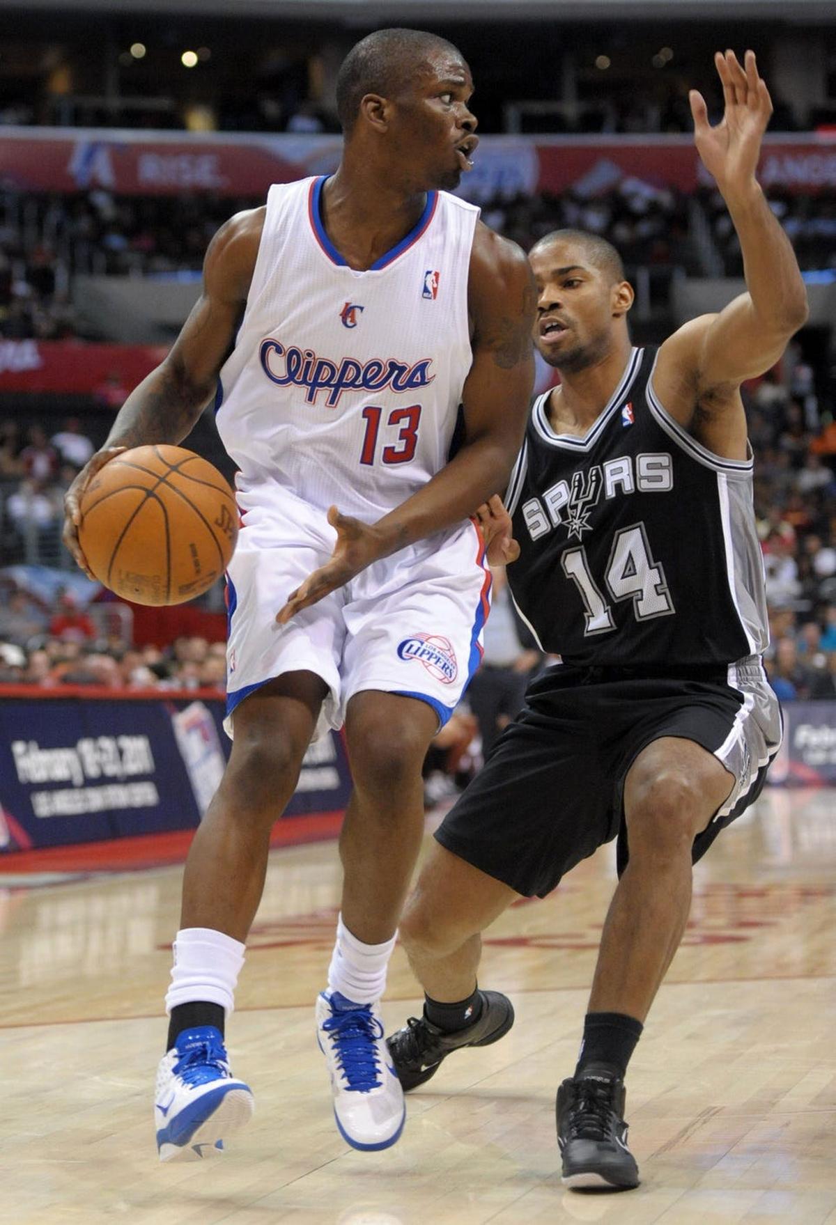 Nov 1, 2010; Los Angeles, CA, USA; Los Angeles Clippers guard Willie Warren (13) is defended by San Antonio Spurs guard Gary Neal (14) at the Staples Center. The Spurs defeated the Clippers 97-88. Mandatory Credit: Kirby Lee/Image of Sport-USA TODAY Sports