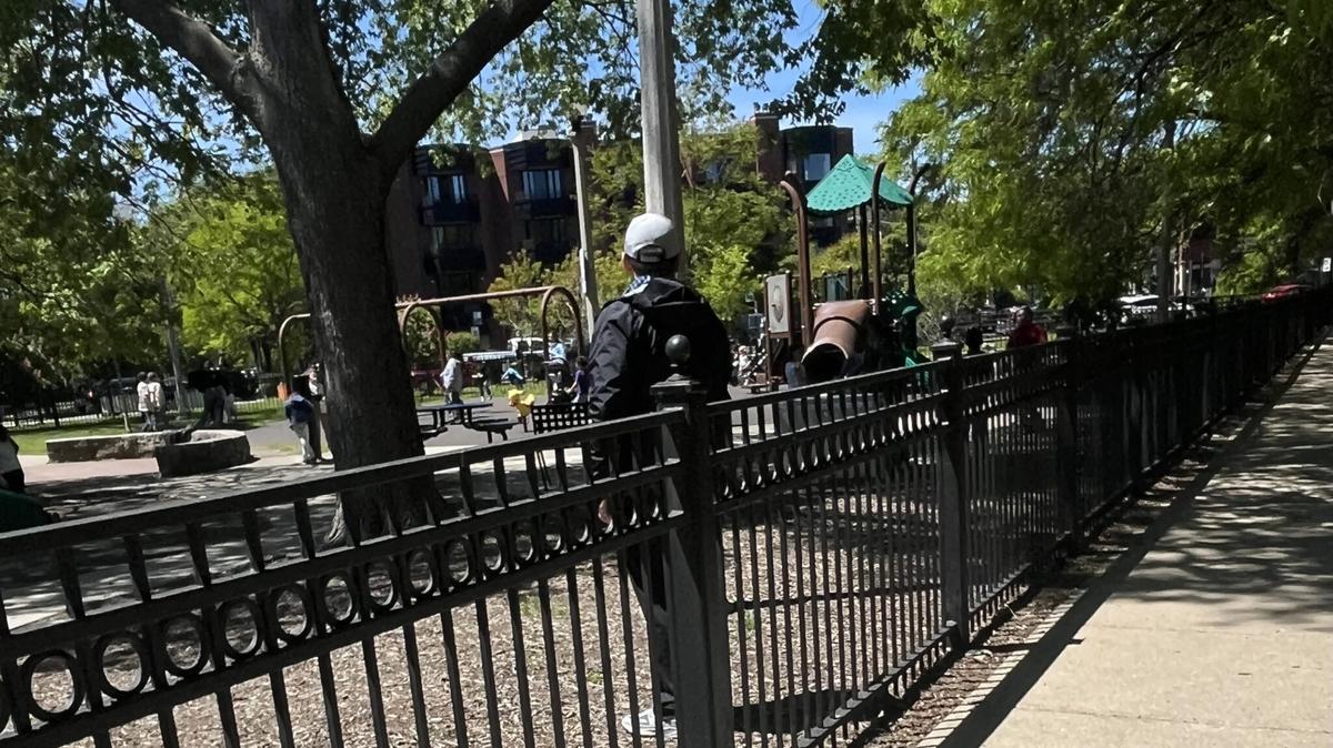 A teacher observes students playing at a Chicago school playground. Many states are grappling over who should be required to report incidents of child neglect and abuse. (Robbie Sequeira/Stateline/TNS)