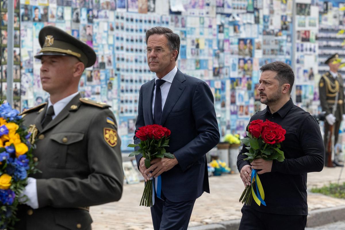 Ukraine's President Volodymyr Zelenskiy and NATO Secretary General Mark Rutte visit the Wall of Remembrance of the Fallen Defenders of Ukraine outside the St. Michael's Cathedral, amid Russia's attack on Ukraine, in Kyiv, Ukraine June 3, 2026. Ukrainian Presidential Press Service/Handout via REUTERS ATTENTION EDITORS - THIS IMAGE HAS BEEN SUPPLIED BY A THIRD PARTY.