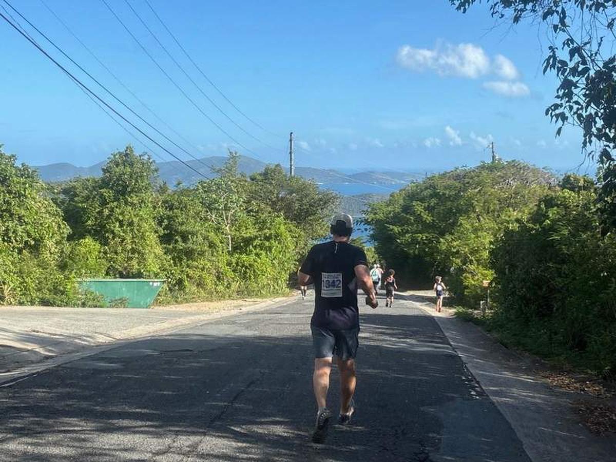  Downhill near the end of 8 Tuff Miles, with children still running the race. Photo credit: Judy Antell 