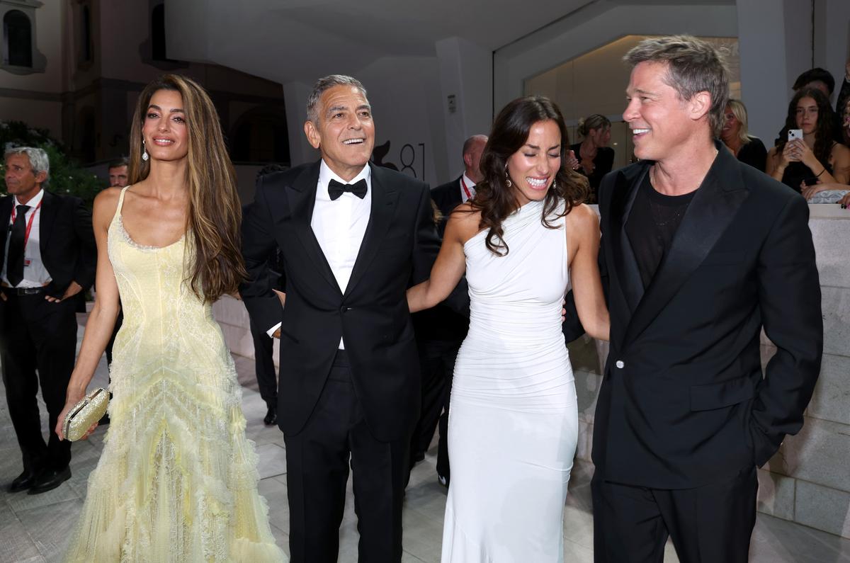 VENICE, ITALY - SEPTEMBER 01: (L-R) Amal Clooney, George Clooney, Ines de Ramon and Brad Pitt attend the “Wolfs” red carpet during the 81st Venice International Film Festival on September 01, 2024 in Venice, Italy. (Photo by Pascal Le Segretain/Getty Images)