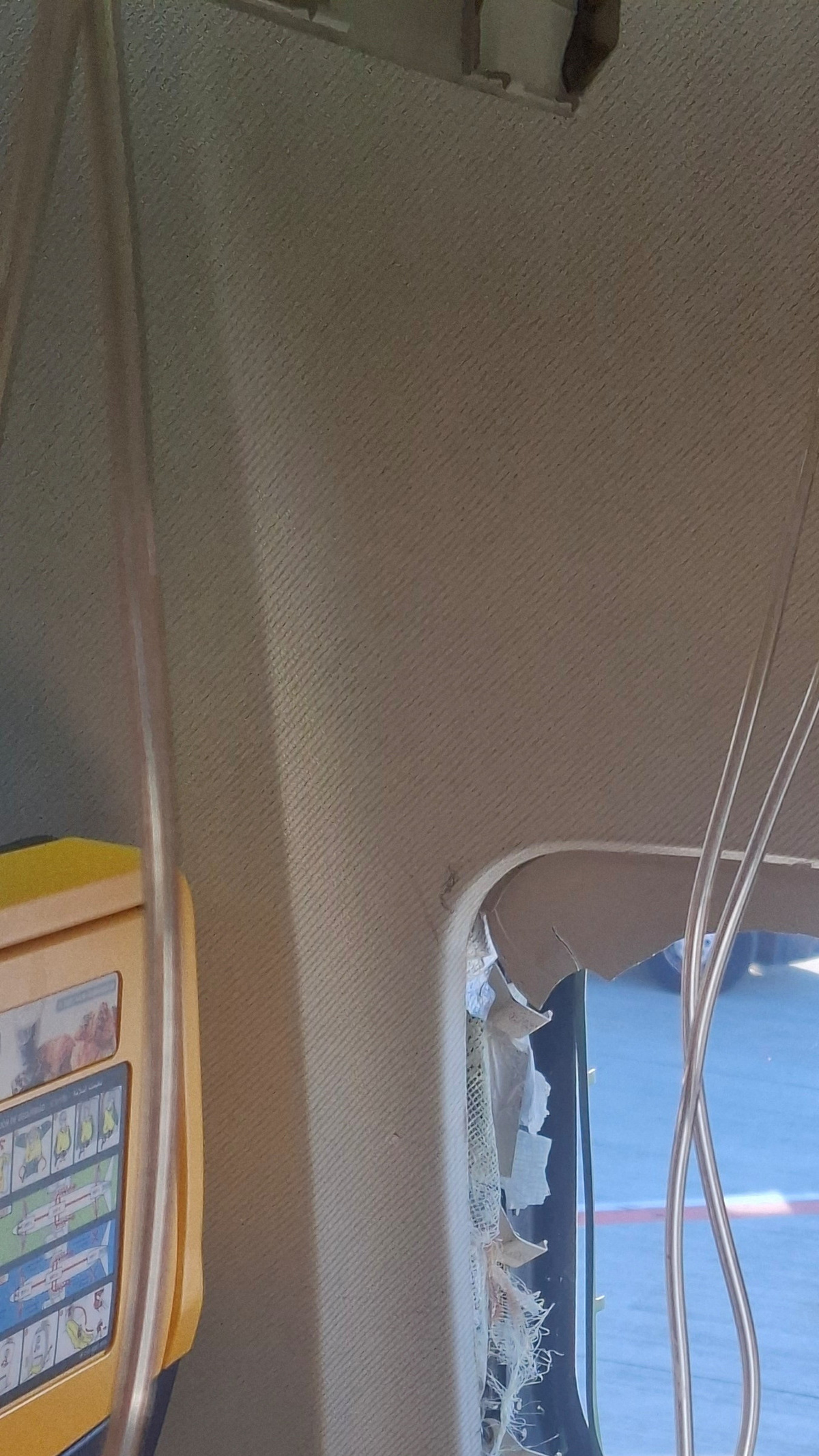 A broken window of the Ryanair aircraft, following a reported emergency landing, in location given as Thessaloniki, Greece, July 10, 2026, in this picture obtained from social media. Despoina Papapavlou/via REUTERS  THIS IMAGE HAS BEEN SUPPLIED BY A THIRD PARTY. MANDATORY CREDIT.  VERIFICATION LINES:  - The interior of the cabin, including the seats and windows, matched archive images of a Ryanair Boeing 737  - The broken window matches Reuters reporting about a passenger who was partially sucked through a dislodged window on a Ryanair Boeing 737 flight on July 10  - Corroborating visuals from local media match the shape and cracks of the broken window - Date confirmed by original file metadata