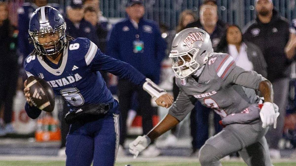  Nevada quarterback Carter Jones (6) runs from UNLV safety Jaheem Joseph (3) in the second half of an NCAA college football game in Reno, Nev., Saturday, Nov. 29, 2025. | Tom R. Smedes/Special to the RGJ / USA TODAY NETWORK via Imagn Images 