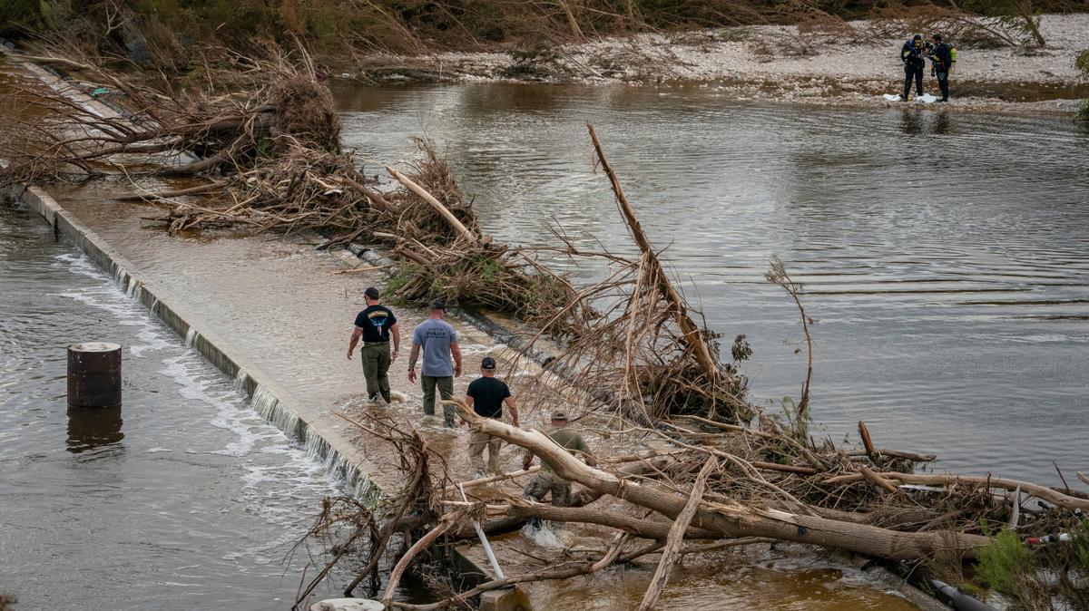 Response personnel attempt to recover a body in the Guadalupe River following catastrophic flooding in Kerrville, Texas, on Wednesday, July 9, 2025.