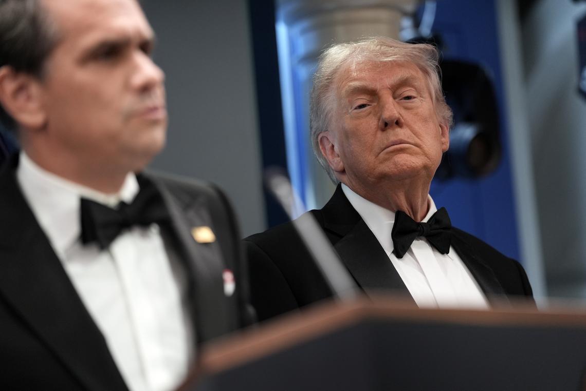 President Donald Trump looks on as Acting Attorney General Todd Blanche briefs reporters at the White House after shots were fired during the White House Correspondents' Association dinner at the Washington Hilton in Washington on Saturday, April 25, 2026. Trump was rushed from the stage but was unharmed. (Salwan Georges/The New York Times)