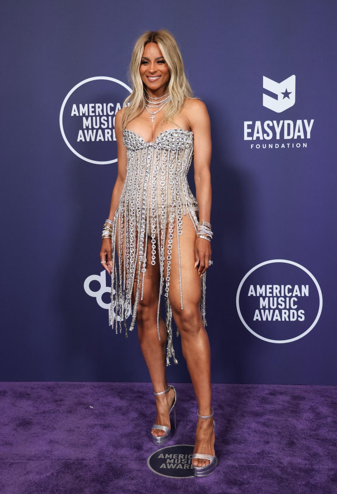 Ciara – Best Ciara brought sparkle to the AMAs in a glittery silver dress that allowed her to show off her legs. Michael Tran / AFP