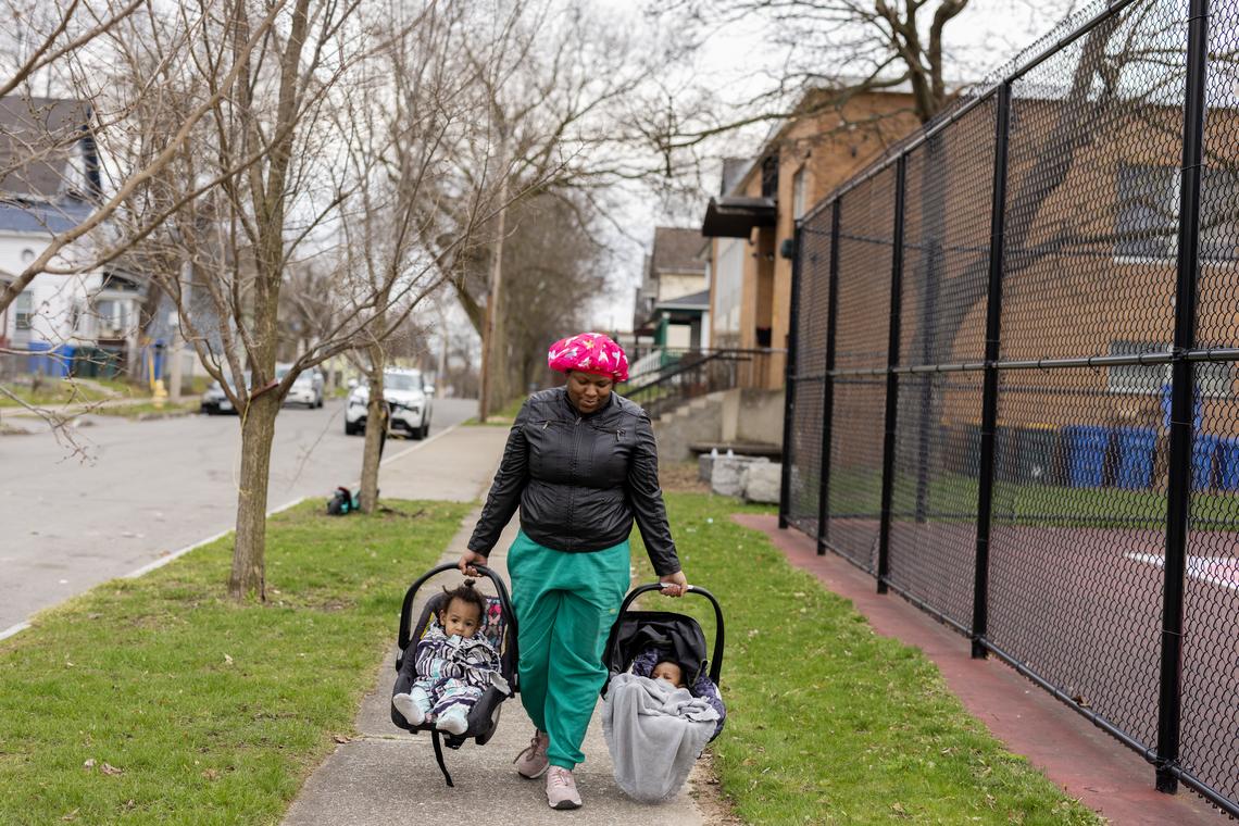 Kristina Green, who according to her complaint was denied requests to sit or transfer to a less strenuous job, carries her children in Rochester, N.Y., April 10, 2026. The Pregnant Workers Fairness Act, which took effect in June 2023, gave workers a right to reasonable accommodations related to pregnancy. (Maddie McGarvey/The New York Times)