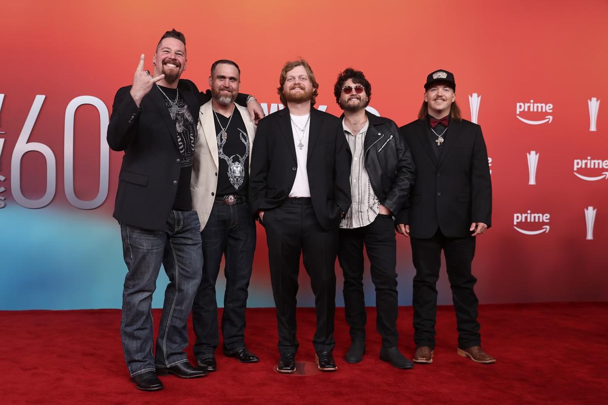 Omar Vega/WireImageTreaty Oak Revival The country group all wore shades of black as they posed on the red carpet. 