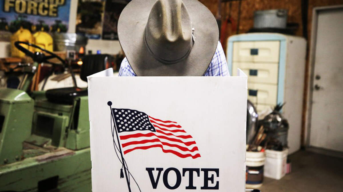A voter marks his ballot at a polling place in Dennis Wilkening's shed in Richland, Iowa, on Nov. 3, 2020. There have been dozens of investigations, audits, recounts and court proceedings at the local, state and federal levels that examined the 2020 election, which experts said may have been the most scrutinized election in U.S. history.