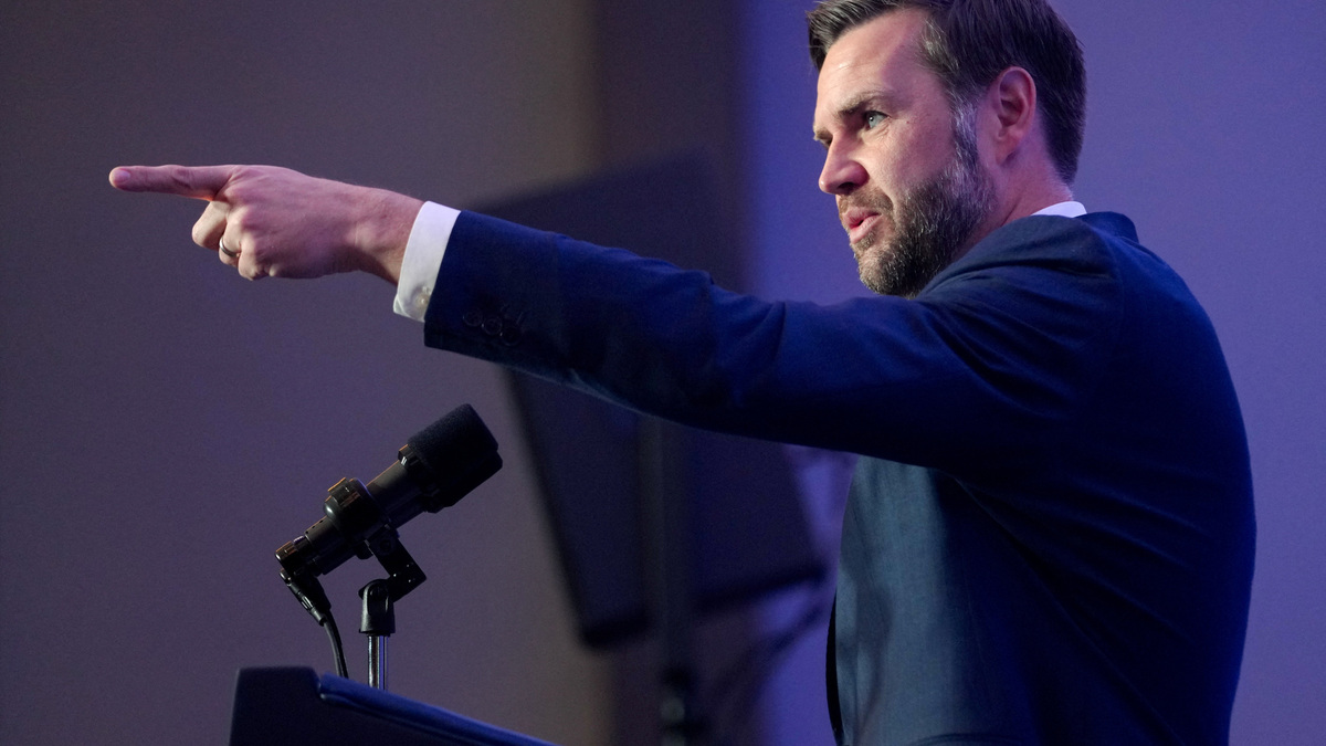 U.S. Vice President JD Vance points as he speaks to members of the media before boarding Air Force Two, after the U.S. and Iran held high-level talks at the Lake Lucerne Summit, at Emmen Military Air Base, Emmen, Switzerland, June 22, 2026. REUTERS/Nathan Howard/Pool
