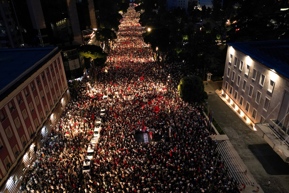 A drone view of protesters waving Albanian National flags during a protest against a luxury resort, a plan by a company linked to U.S. President Donald Trump's son-in-law, Jared Kushner, on an environmentally sensitive part of the Adriatic coast, in Tirana, Albania, June 10, 2026. REUTERS/Florion Goga
