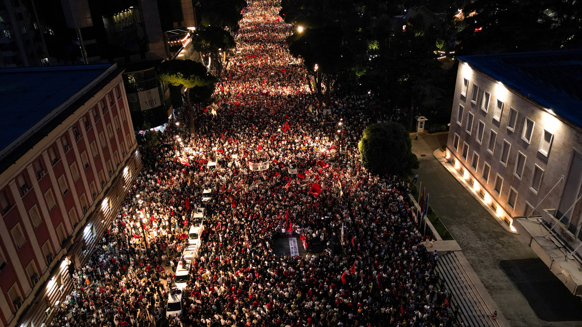 A drone view of protesters waving Albanian National flags during a protest against a luxury resort, a plan by a company linked to U.S. President Donald Trump's son-in-law, Jared Kushner, on an environmentally sensitive part of the Adriatic coast, in Tirana, Albania, June 10, 2026. REUTERS/Florion Goga