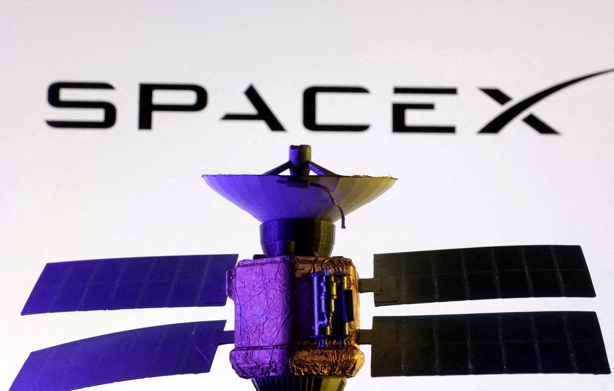 FILE PHOTO: SpaceX logo and miniature satellite model are seen in this illustration taken, March 10, 2025. REUTERS/Dado Ruvic/Illustration/File Photo/File Photo