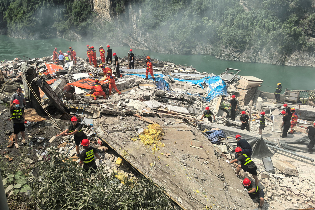 Rescue workers search for survivors at the site of a landslide along Wujiang river in Pengshui Miao and Tujia Autonomous County, Chongqing, China July 17, 2026. cnsphoto via REUTERS