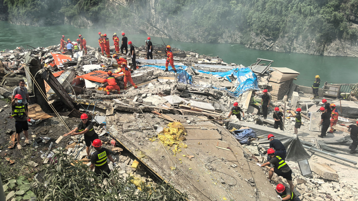 Rescue workers search for survivors at the site of a landslide along Wujiang river in Pengshui Miao and Tujia Autonomous County, Chongqing, China July 17, 2026. cnsphoto via REUTERS