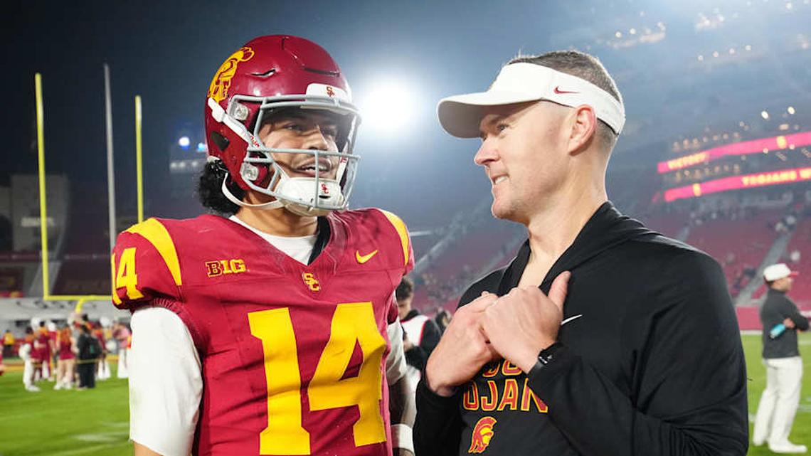  Nov 29, 2025; Los Angeles, California, USA; Southern California Trojans quarterback Jayden Maiava (14) and head coach Lincoln Riley react after the game against the UCLA Bruins at United Airlines Field at Los Angeles Memorial Coliseum | Kirby Lee-Imagn Images 