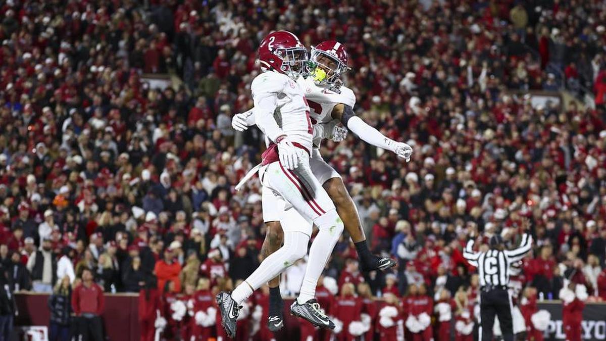  Dec 19, 2025; Norman, OK, USA; Alabama Crimson Tide defensive back Zabien Brown (2) celebrates scoring a touchdown after an interception in the first half against the Oklahoma Sooners at Gaylord Family OK Memorial Stadium. Mandatory Credit: Mark J. Rebilas-Imagn Images | Mark J. Rebilas-Imagn Images 