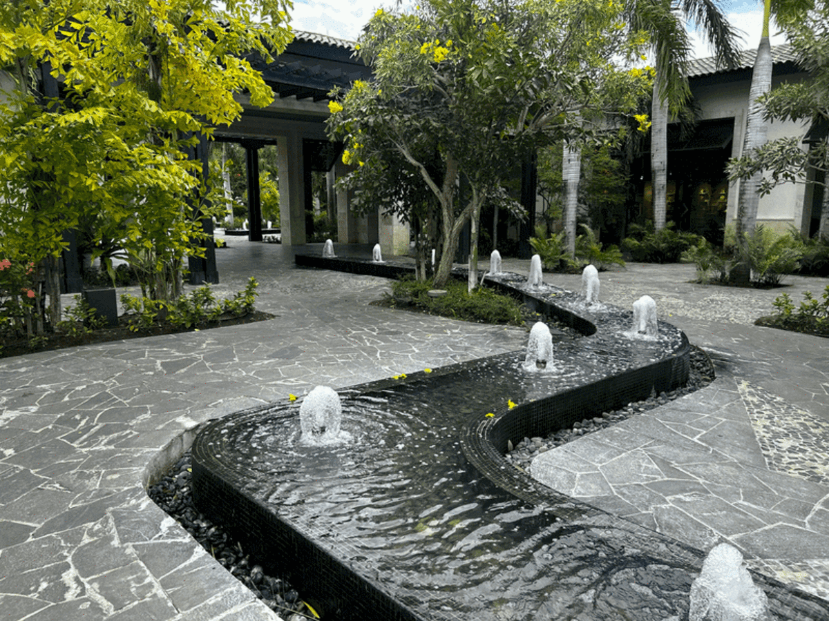  Taking a quiet, meditative stroll through the resort’s tranquil grounds to slow down and enjoy the downtime. Photo credit: Lauren Harby 
