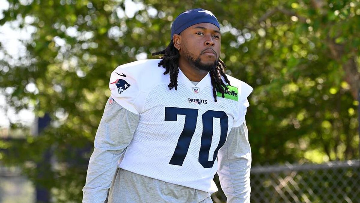  Jul 23, 2025; Foxborough, MA, USA; New England Patriots offensive tackle Caedan Wallace (70) walks to the practice field for training camp at Gillette Stadium. Mandatory Credit: Eric Canha-Imagn Images | Eric Canha-Imagn Images 