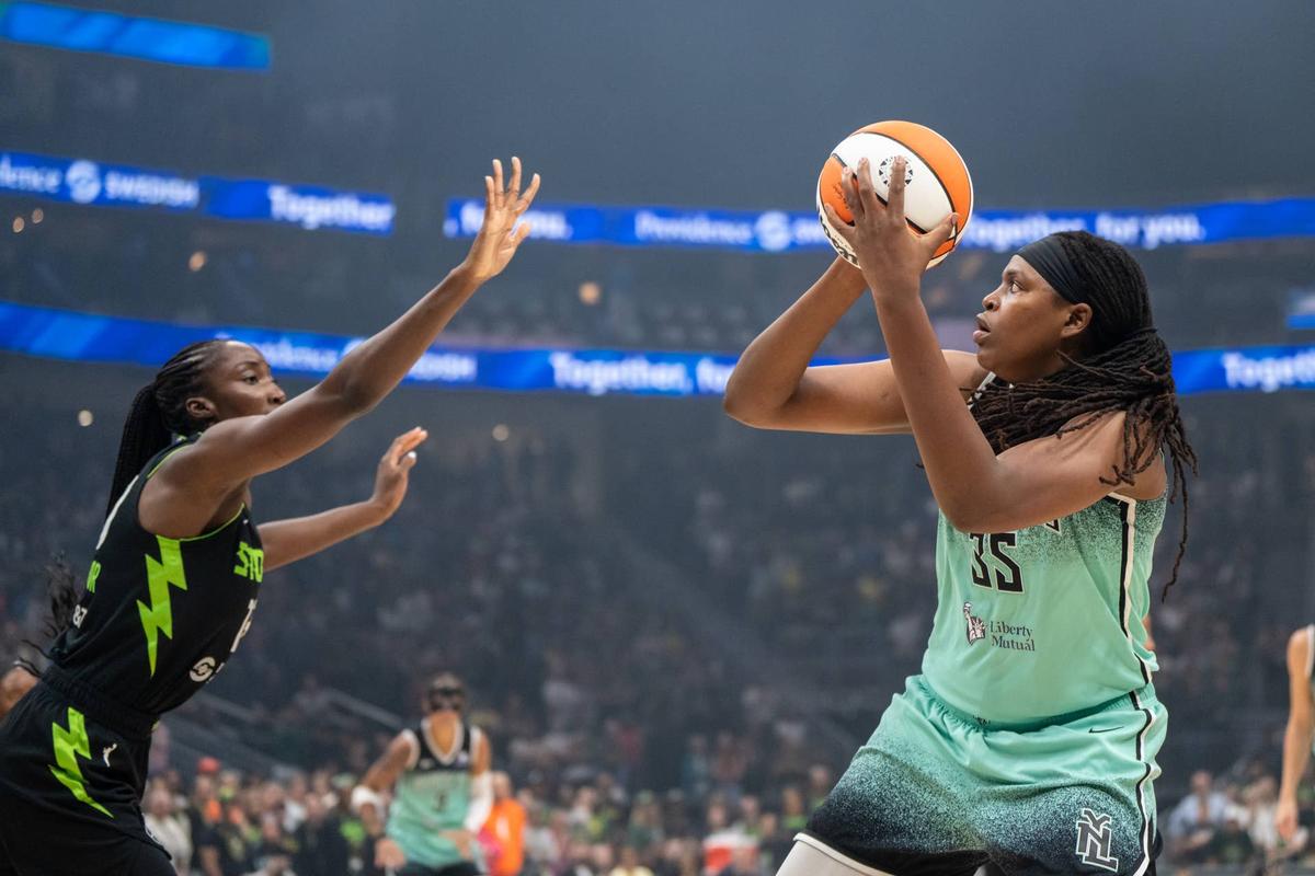  New York Liberty center Jonquel Jones prepares to shoot over Seattle Storm forward Ezi Magbegor at Climate Pledge Arena on Sept. 5, 2025. Stephen Brashear-Imagn Images